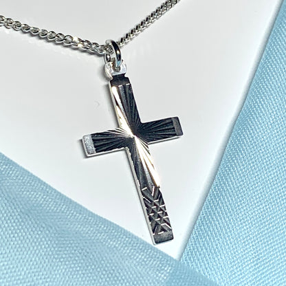 Solid cross patterned sterling silver diamond cut including chain