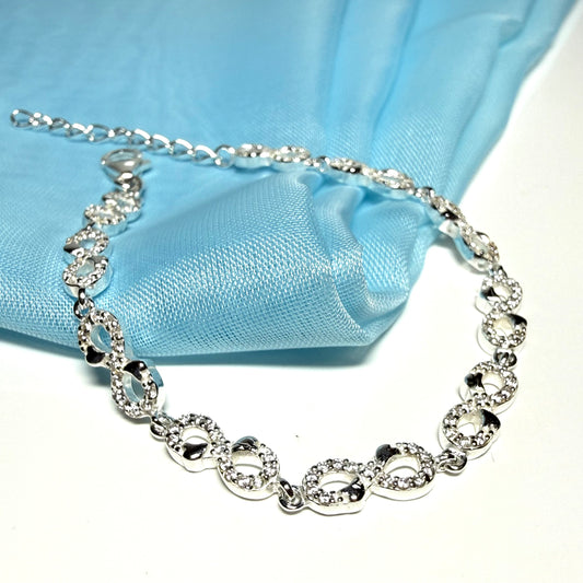 Sparkling infinity style shaped cubic zirconia sterling silver bracelet