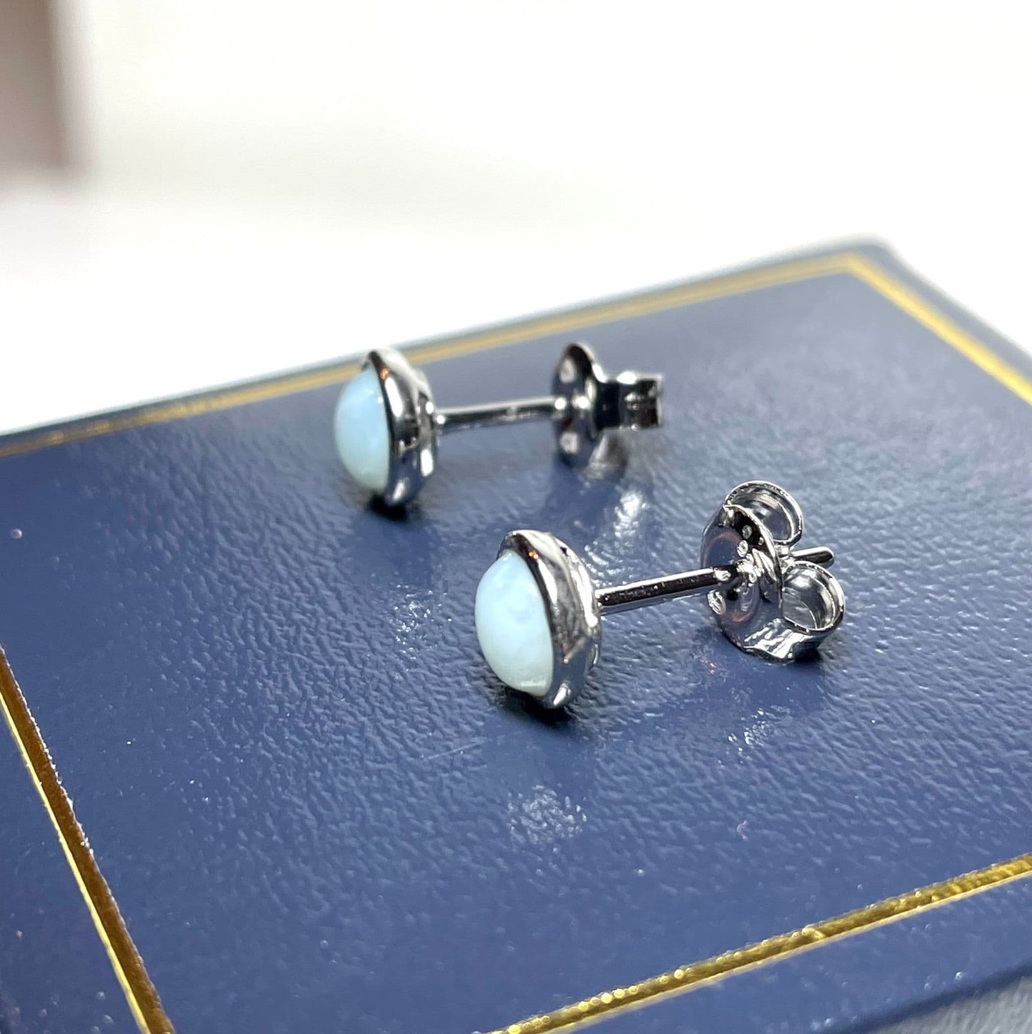 Larimar round sterling silver rubbed over stud earrings