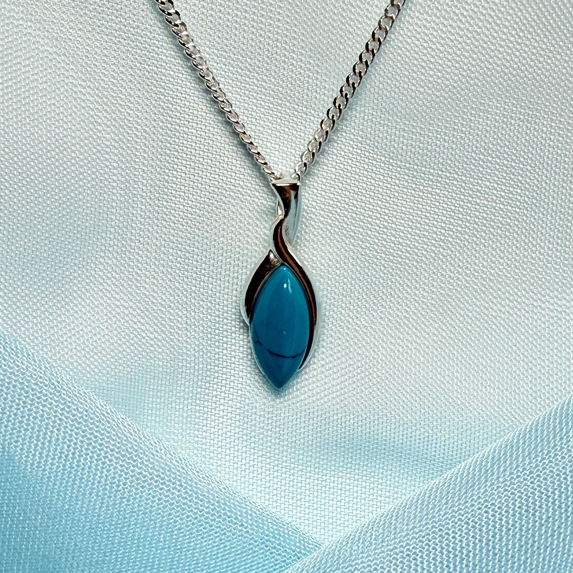 Sterling silver blue turquoise marquise shape necklace twisted pendant with a chain