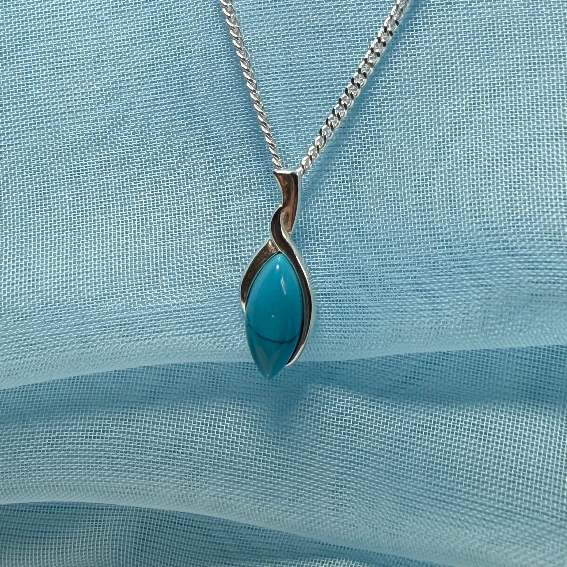 Sterling silver blue turquoise marquise shape necklace twisted pendant with a chain