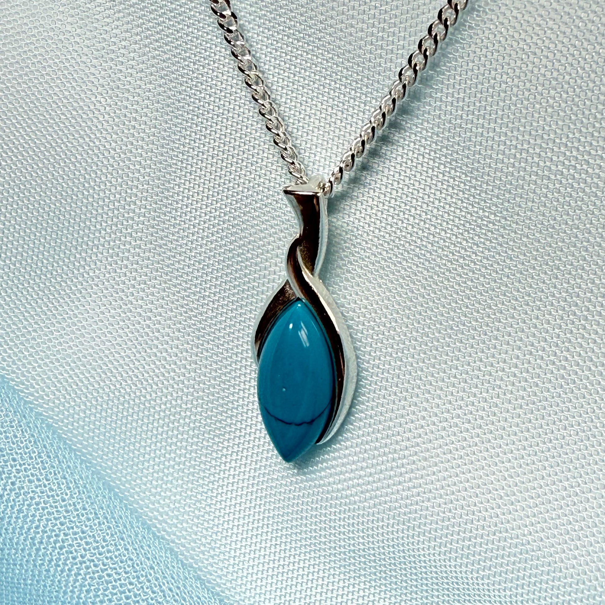 Sterling silver blue turquoise marquise shape necklace twisted pendant with a chain