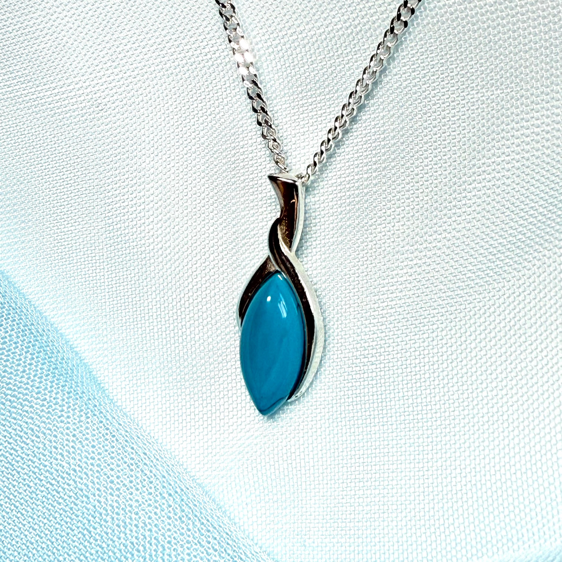 Sterling silver blue turquoise pear shape necklace open teardrop shaped pendant with a chain included