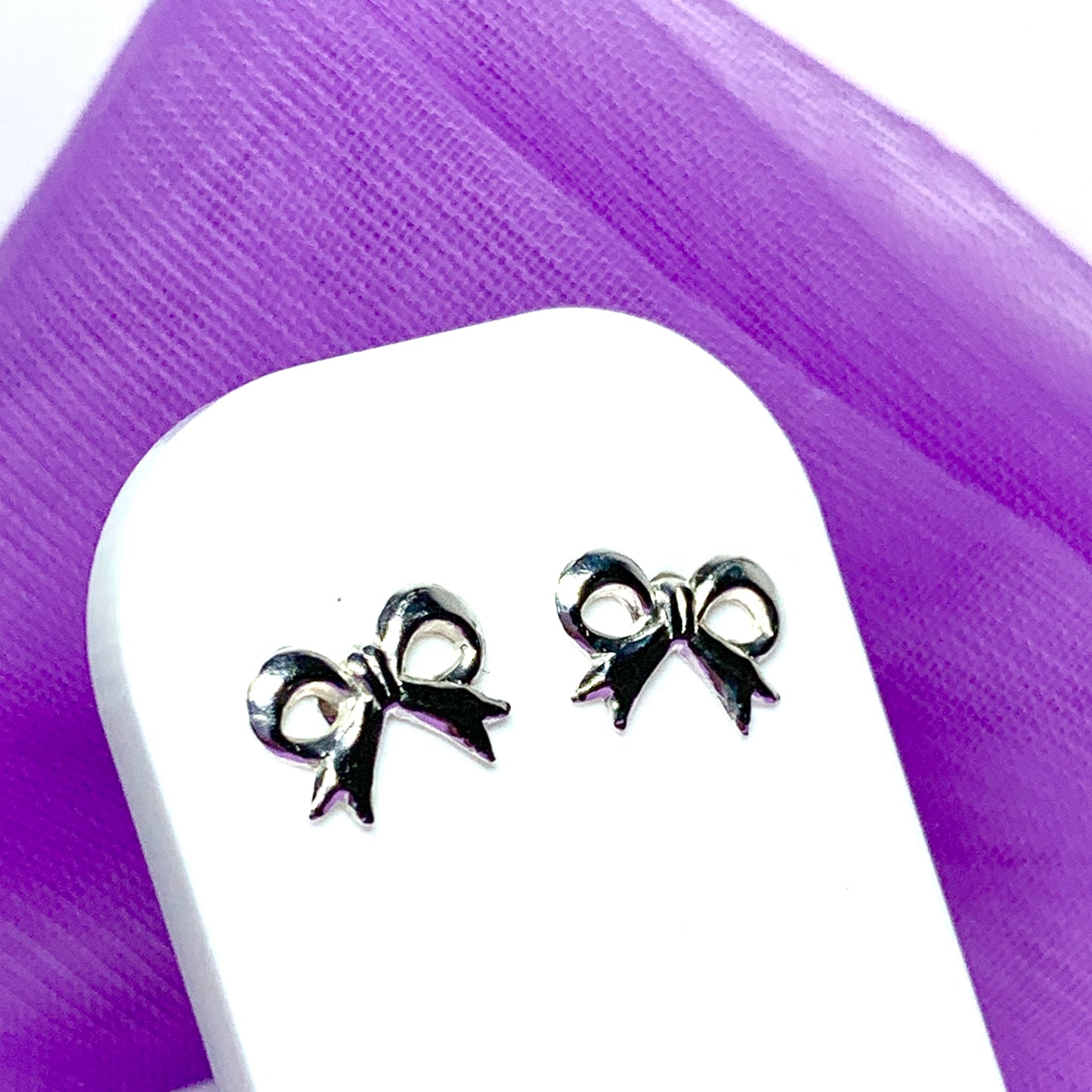 Sterling silver bow shaped stud earrings