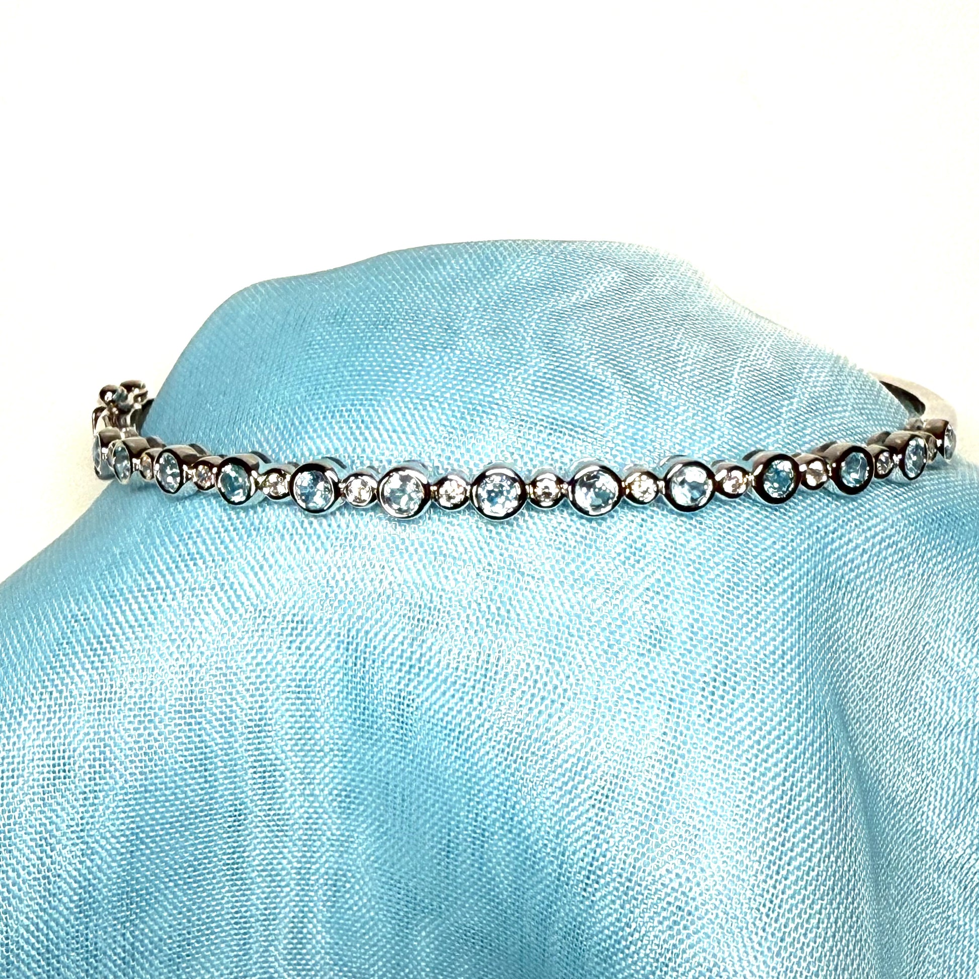 Sterling silver oval shaped real blue topaz cubic zirconia bangle