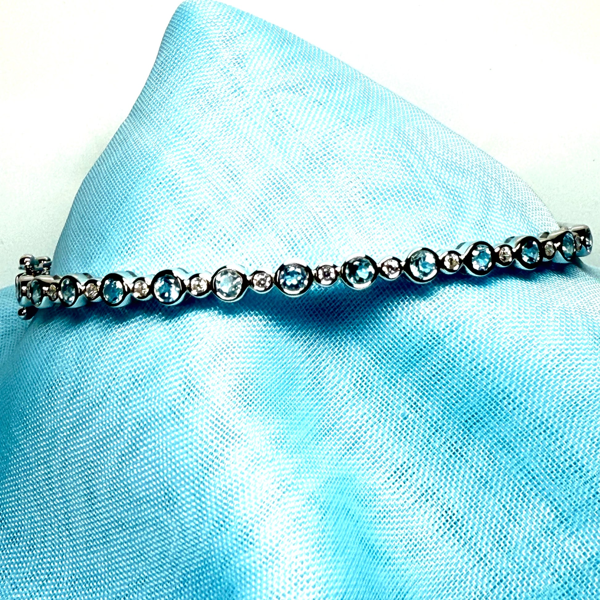 Sterling silver oval shaped real blue topaz cubic zirconia bangle