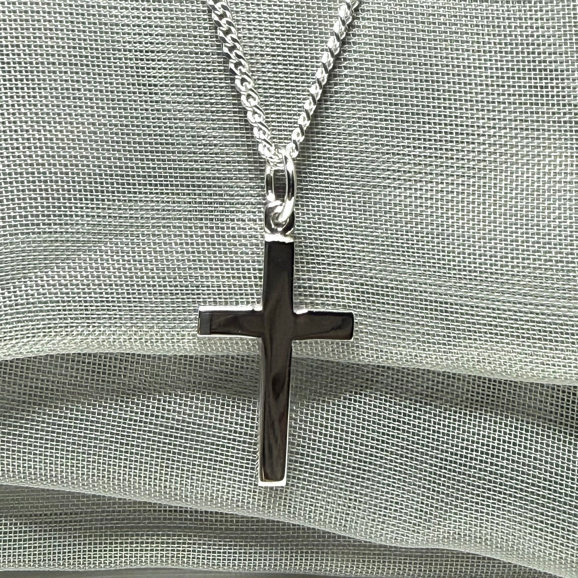 Sterling silver plain polished cross flat design with a chain