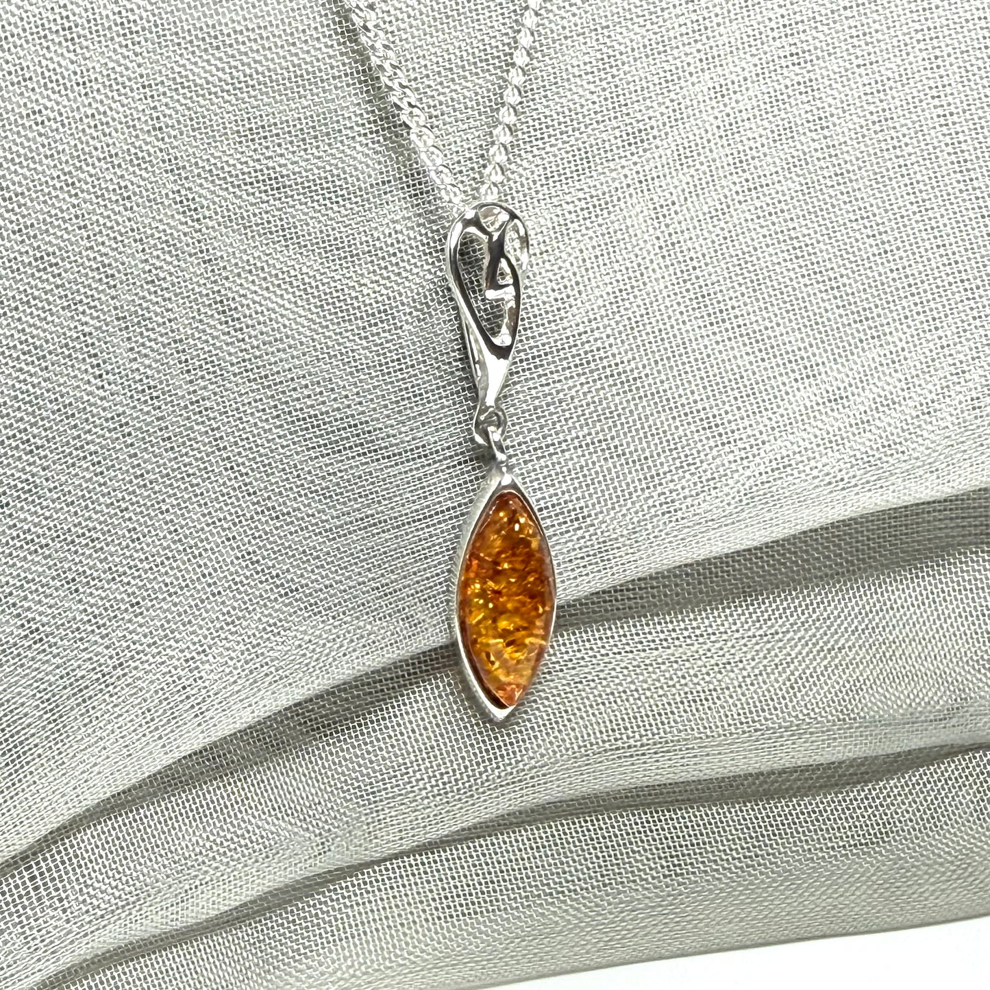 Sterling silver real amber marquise shaped necklace swirled open swirl pendant