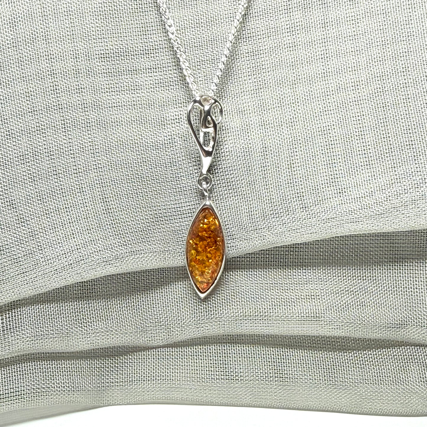 Sterling silver real amber marquise shaped necklace swirled open swirl pendant