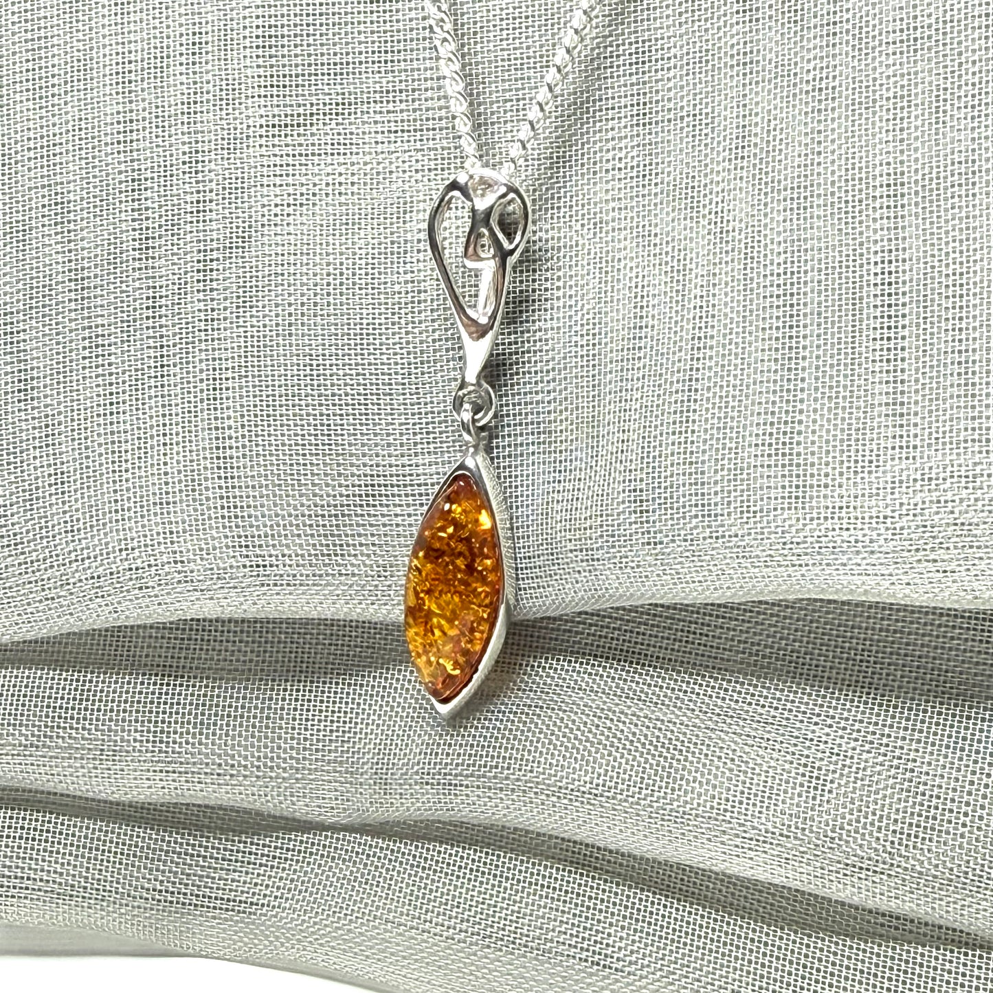 Sterling silver real amber marquise shaped necklace swirled open swirl pendant