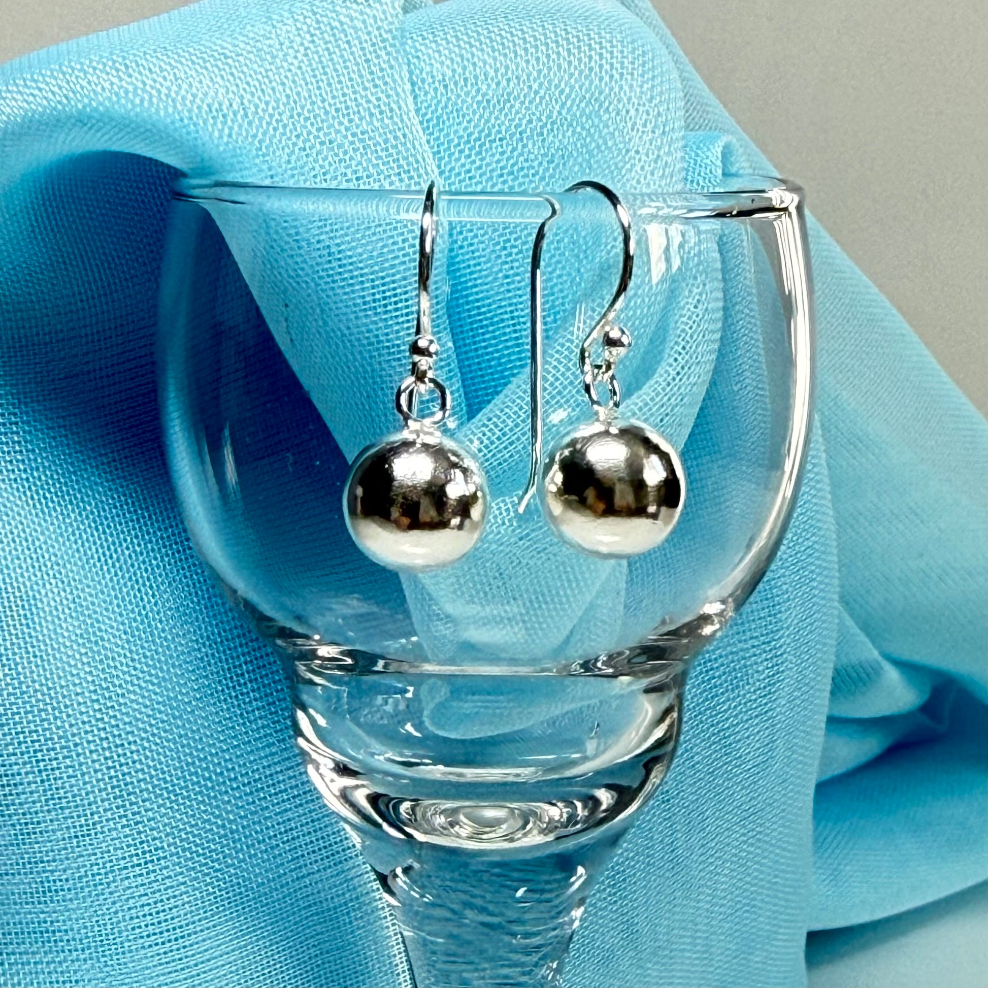 Sterling silver ball shaped drop earrings