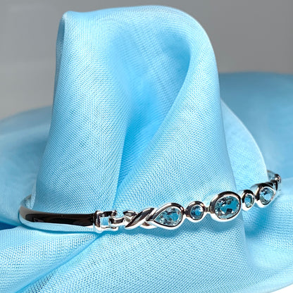 Sterling silver five stone blue topaz bangle