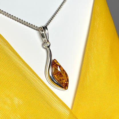 Sterling silver swirl real amber marquise shaped necklace