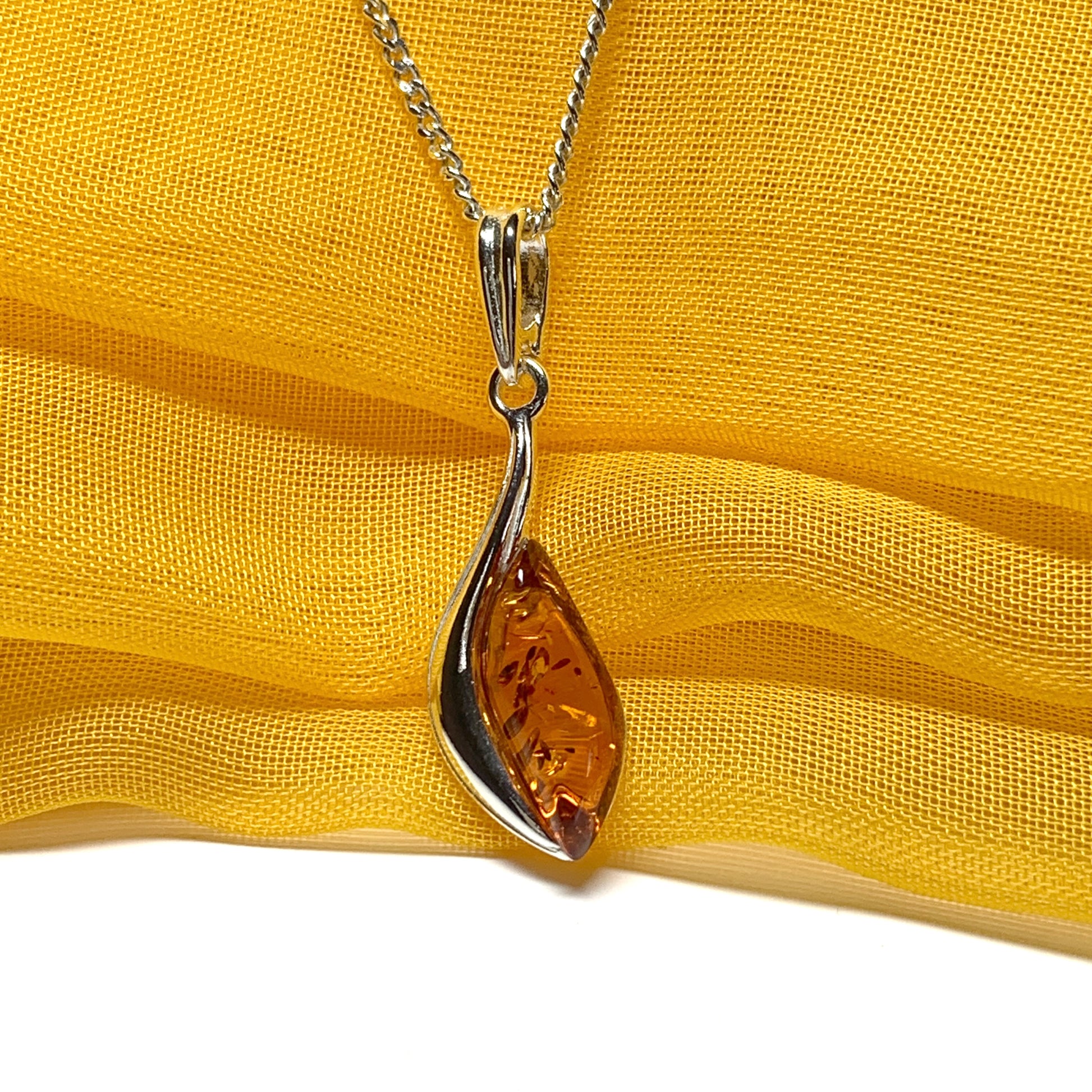 Sterling silver swirl real amber marquise shaped necklace