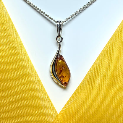 Sterling silver swirl real amber marquise shaped necklace