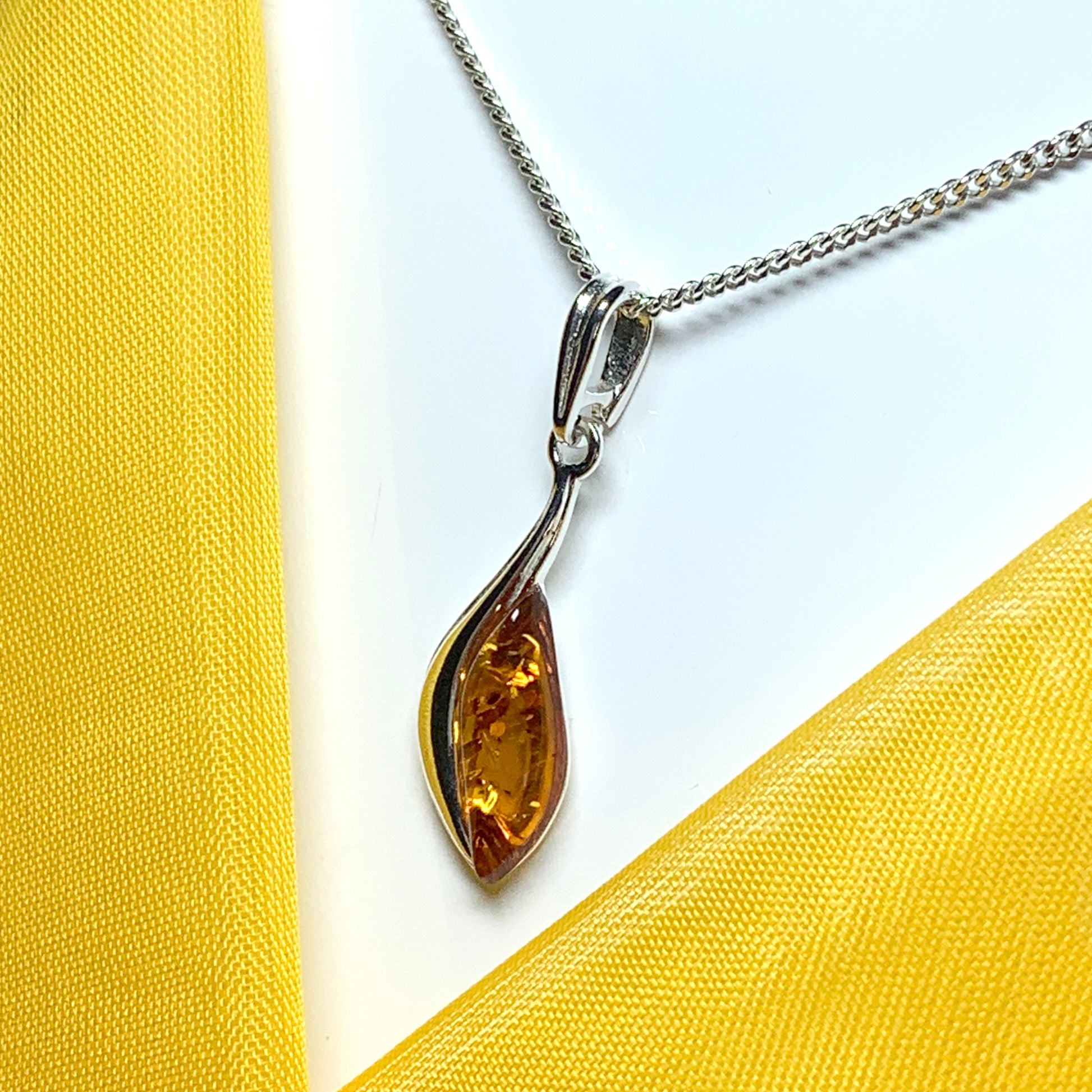 Sterling silver swirl real amber marquise shaped necklace