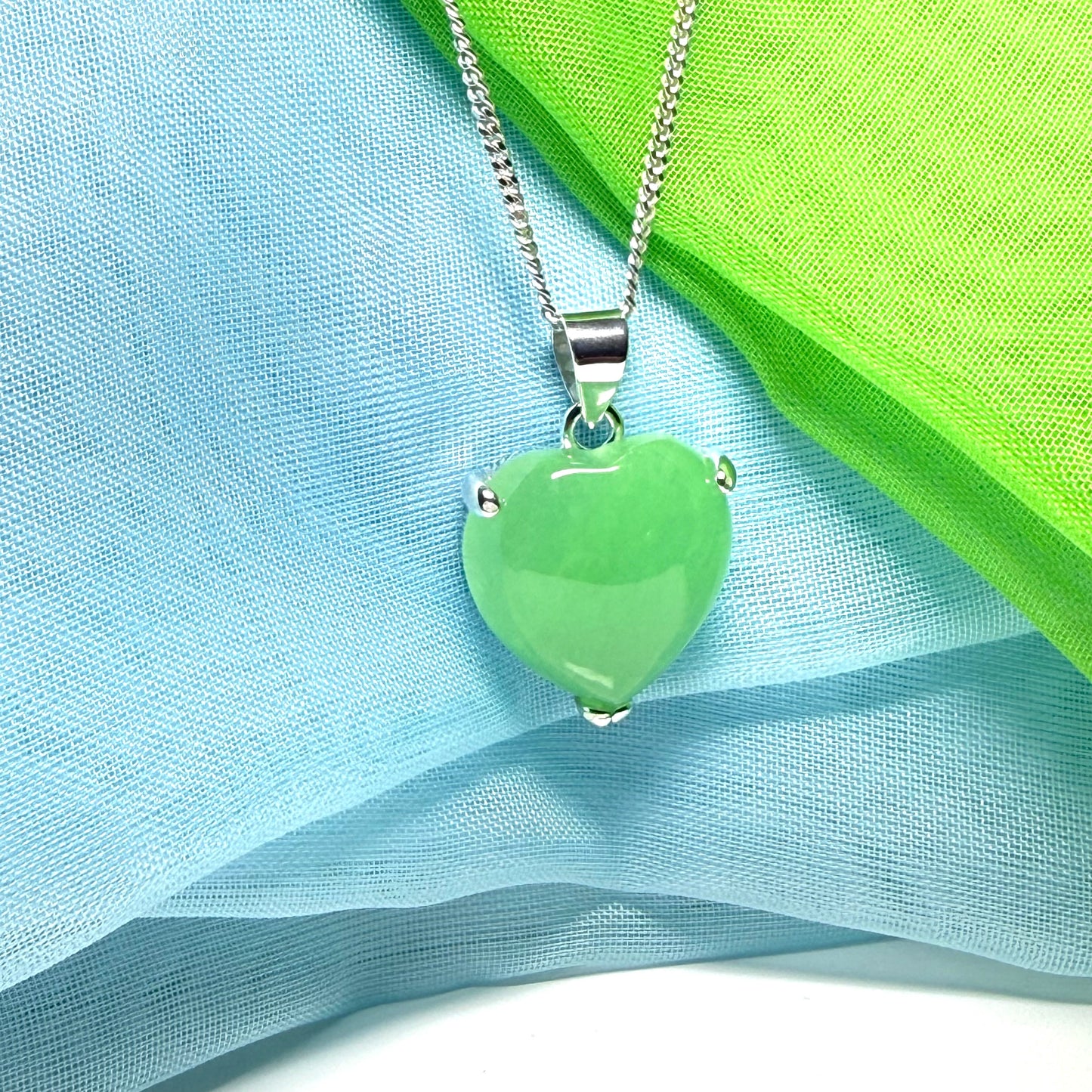 A stunning real green jade necklace heart shaped sterling silver with chain included as well
