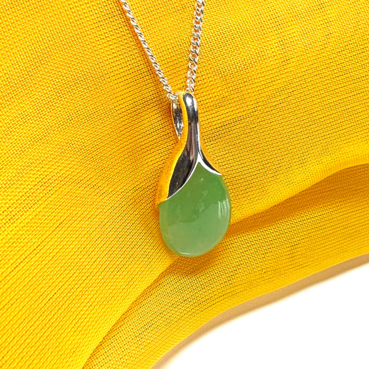A stunning real green jade necklace in a teardrop, a timeless designed pendant and chain included