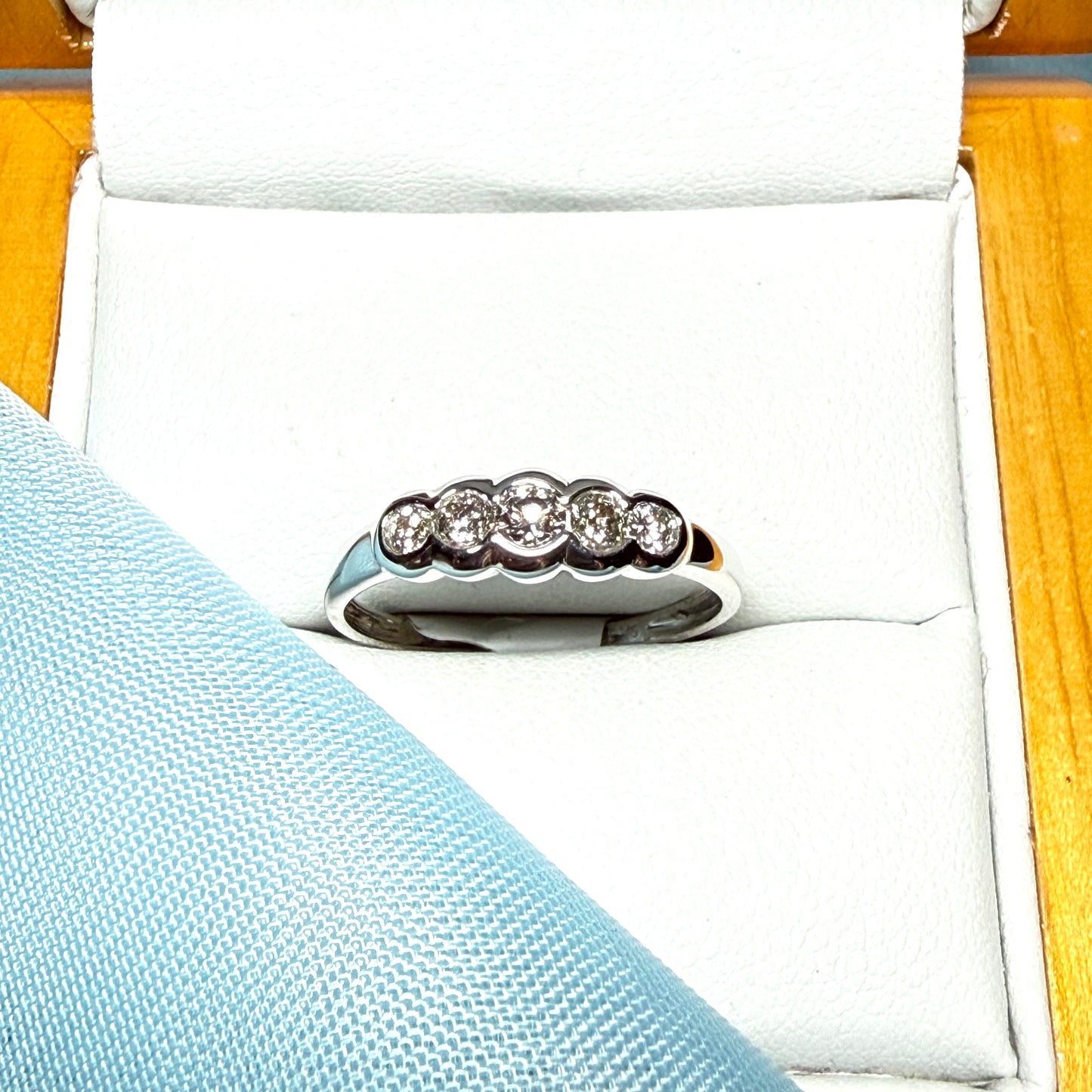 White gold round cut eternity ring diamond rubbed over setting 27 points