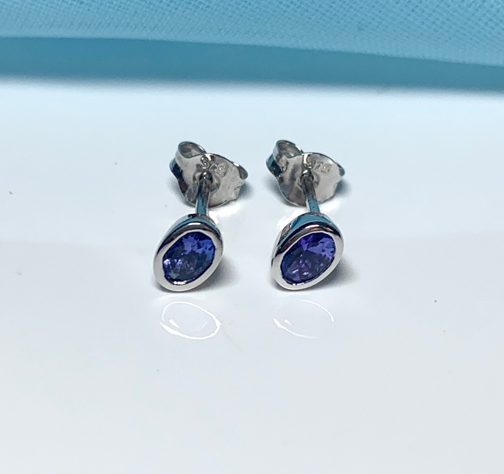 Tanzanite white gold oval stud earrings