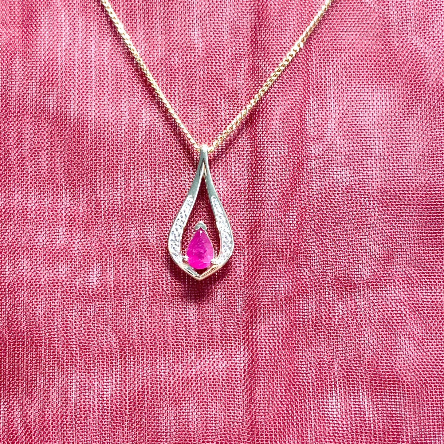 Teardrop red ruby and diamond necklace yellow gold