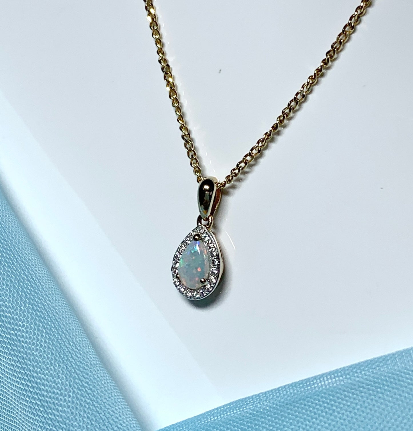 Teardrop shaped opal and diamond yellow gold cluster necklace