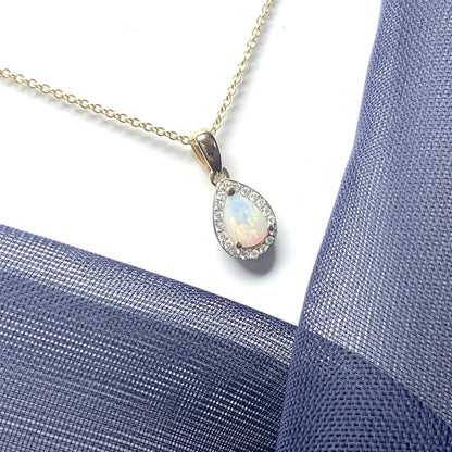 Teardrop shaped opal and diamond yellow gold cluster necklace