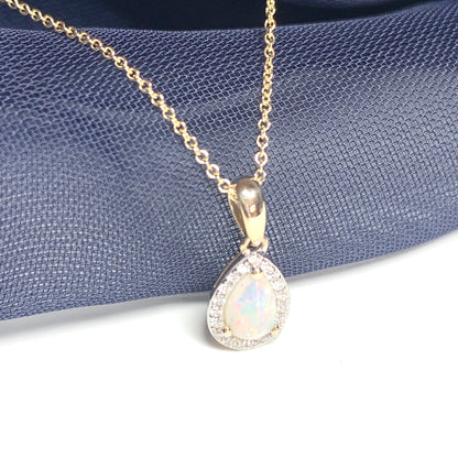 Teardrop shaped opal and diamond yellow gold cluster necklace