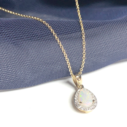 Teardrop shaped opal and diamond yellow gold cluster necklace