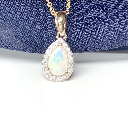 Teardrop shaped opal and diamond yellow gold cluster necklace