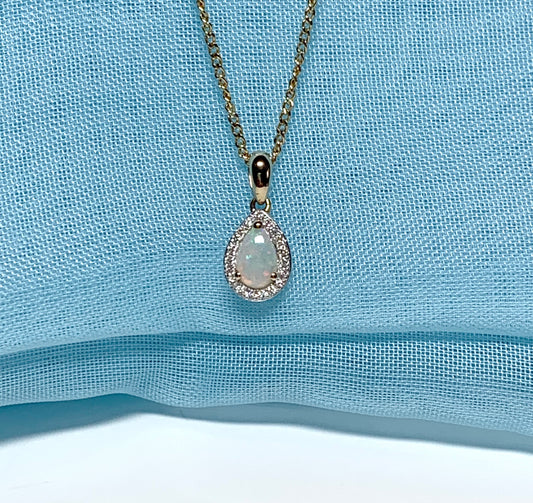 Teardrop shaped opal and diamond yellow gold cluster necklace