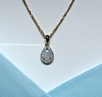 Teardrop shaped opal and diamond yellow gold cluster necklace