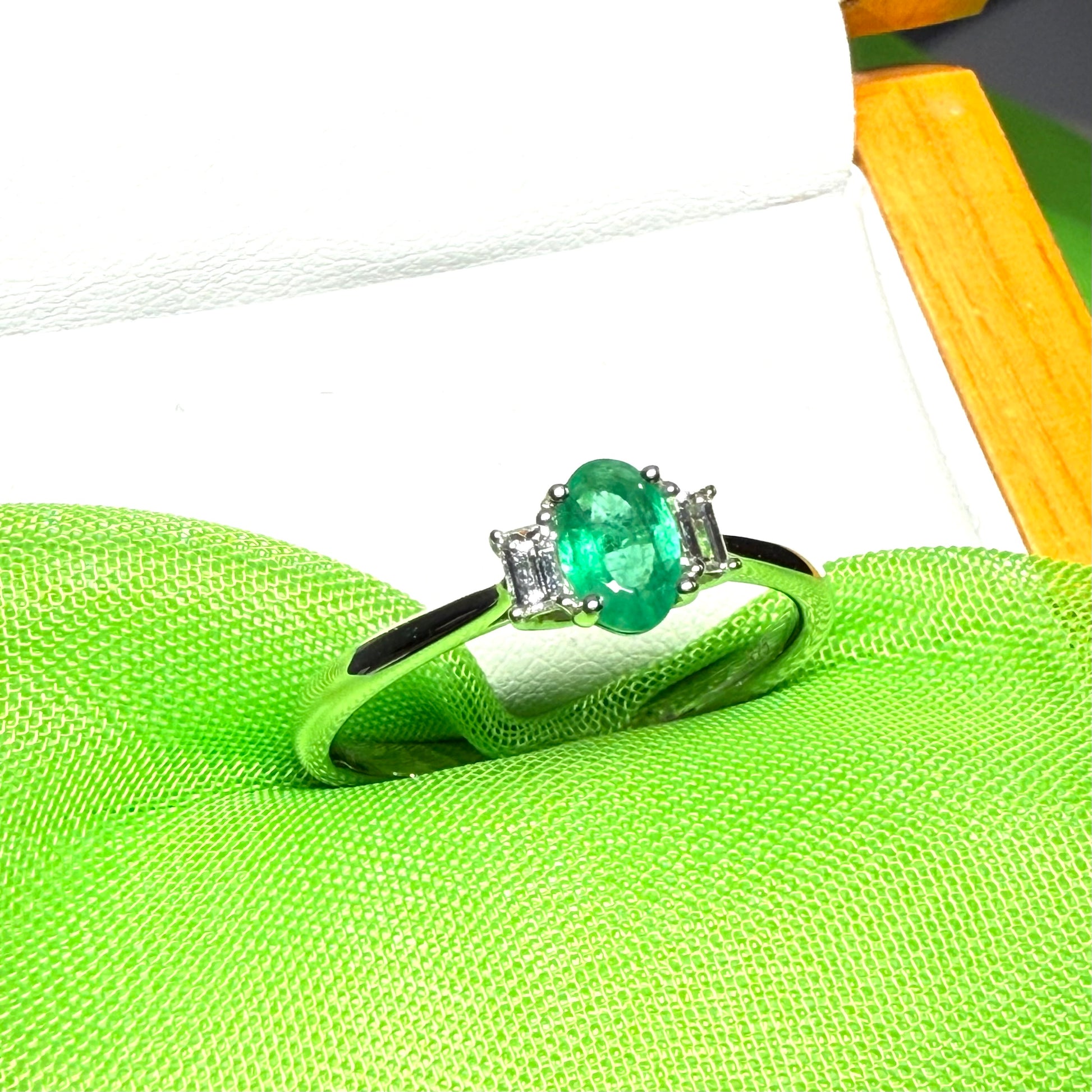 Real emerald and diamond three stone trilogy ring white gold