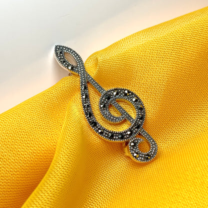 Treble clef brooch set with marcasite stones musical note sterling silver