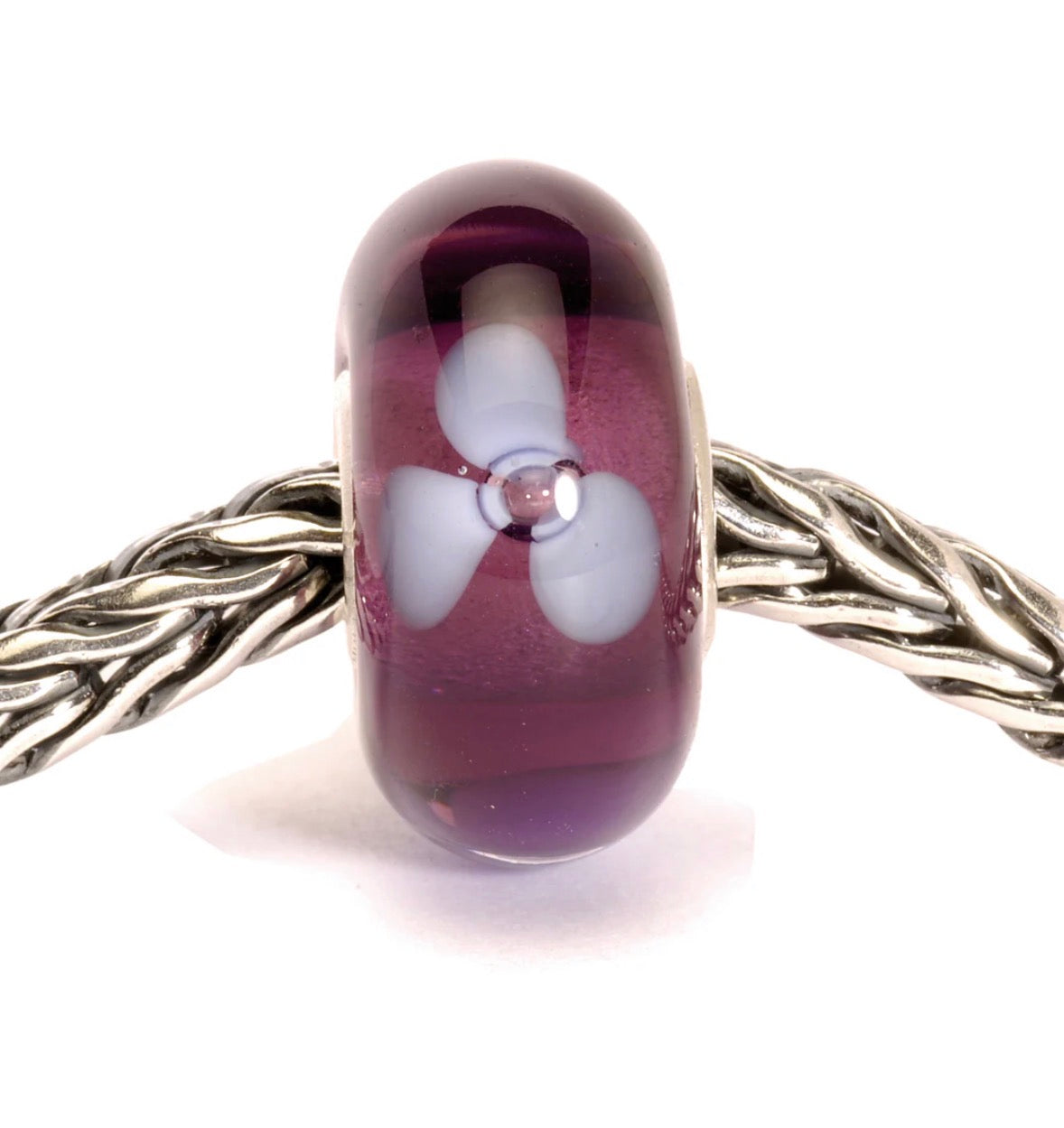Trollbeads Purple Flower Glass Bead TGLBE-10044 on bracelet