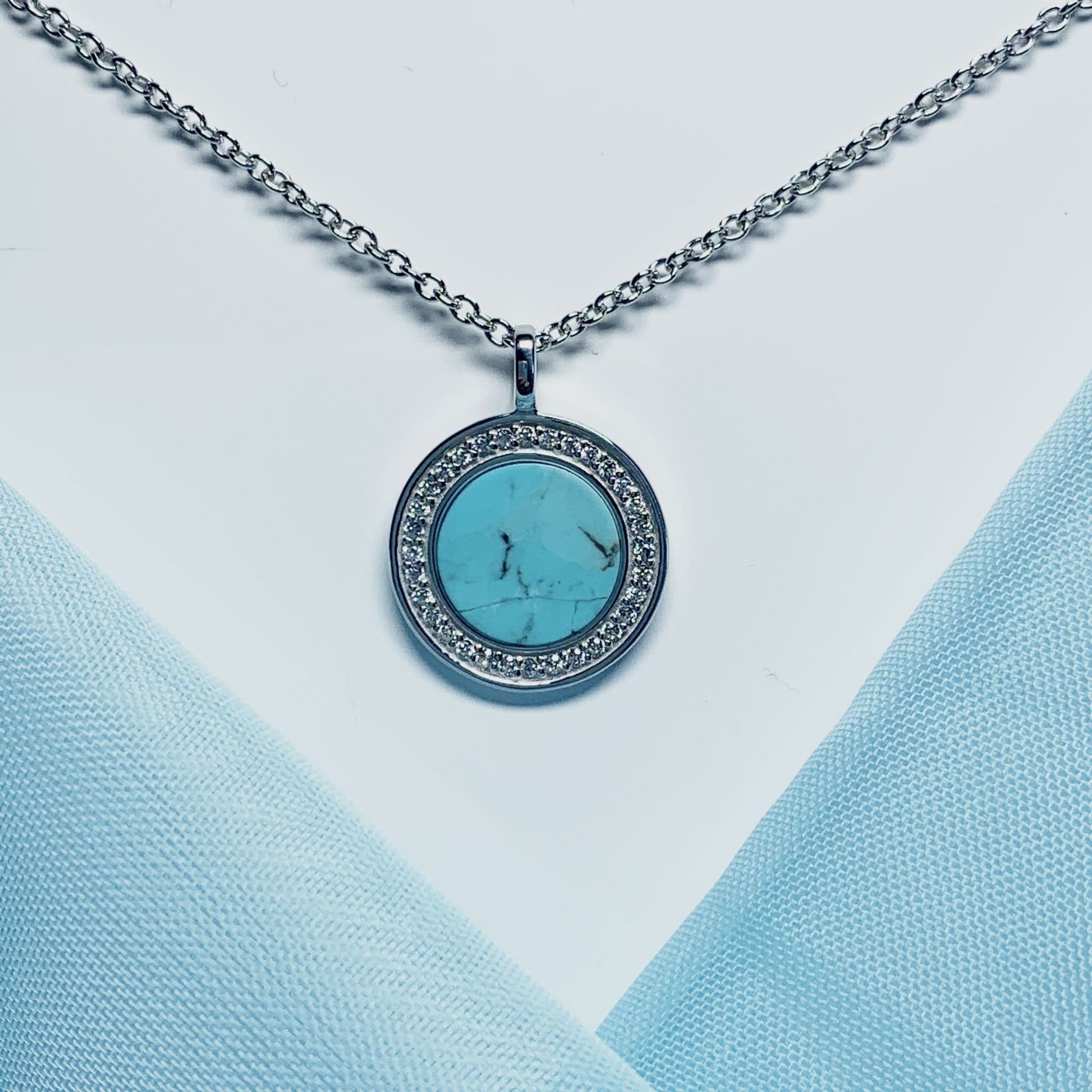 Turquoise and cubic zirconia round sterling silver necklace
