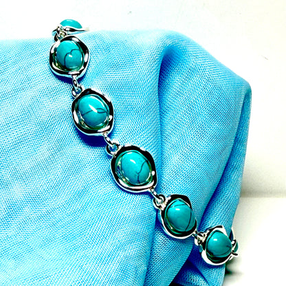 Turquoise sterling silver fancy oval shaped bracelet