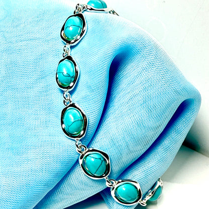 Turquoise sterling silver fancy oval shaped bracelet