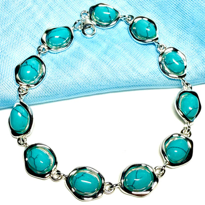 Turquoise sterling silver fancy oval shaped bracelet