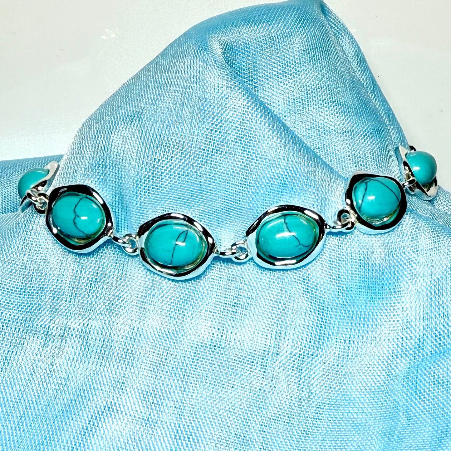 Turquoise sterling silver fancy oval shaped bracelet