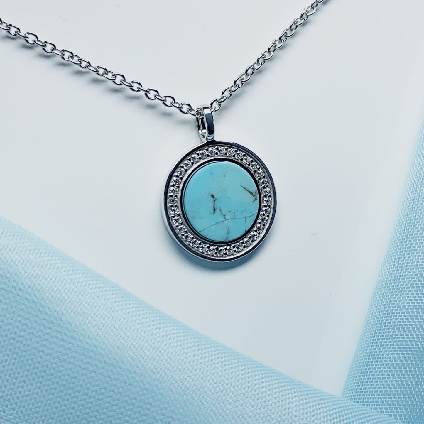 Turquoise and cubic zirconia round sterling silver necklace