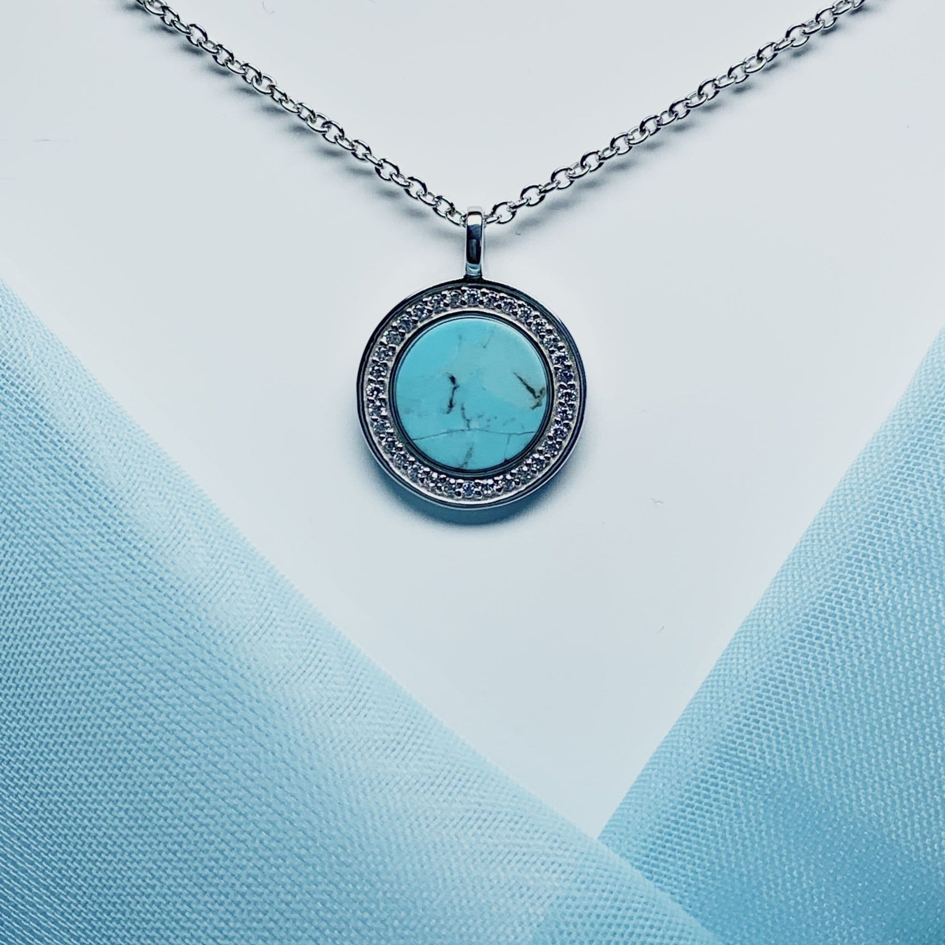 Turquoise and cubic zirconia round sterling silver necklace