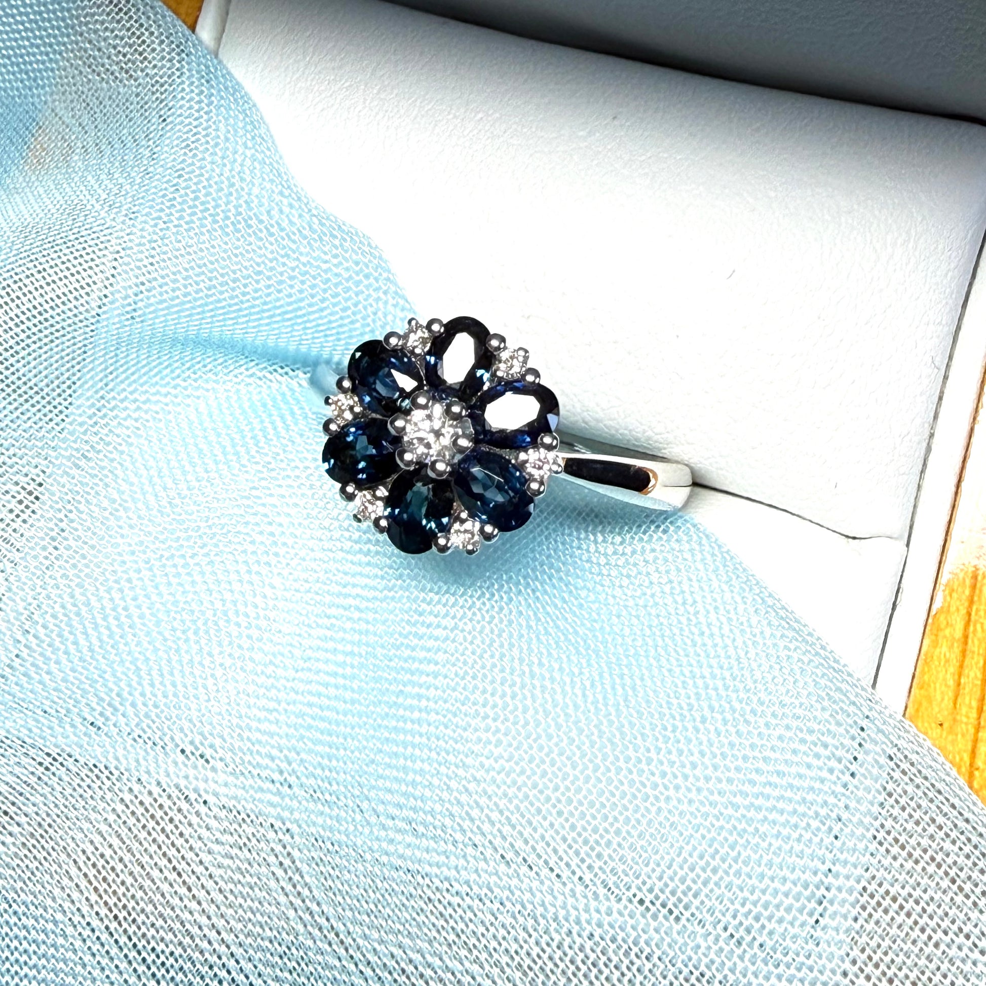 White gold real dark blue sparkling sapphire and diamond round shaped cluster ring