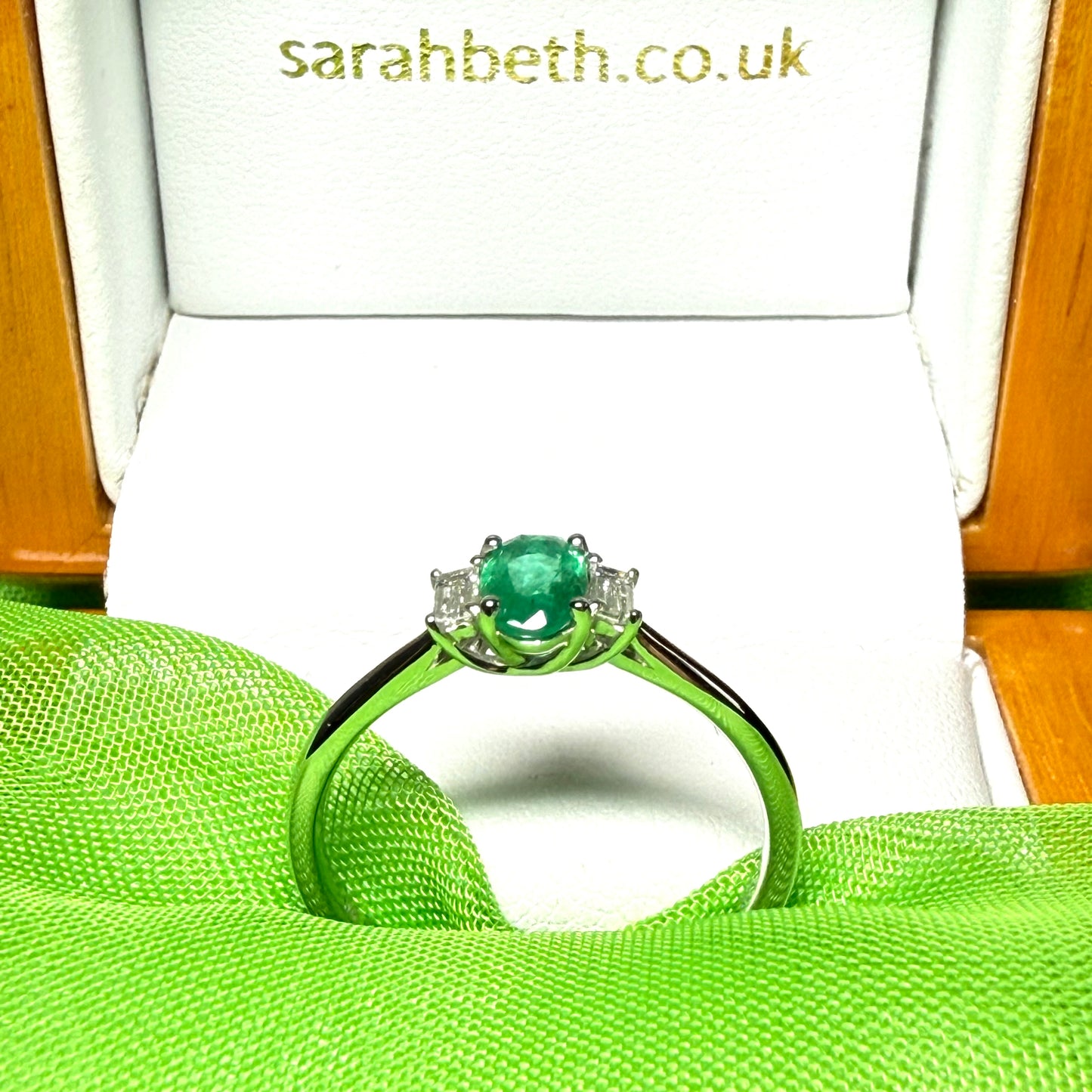 Real emerald and diamond three stone trilogy ring white gold