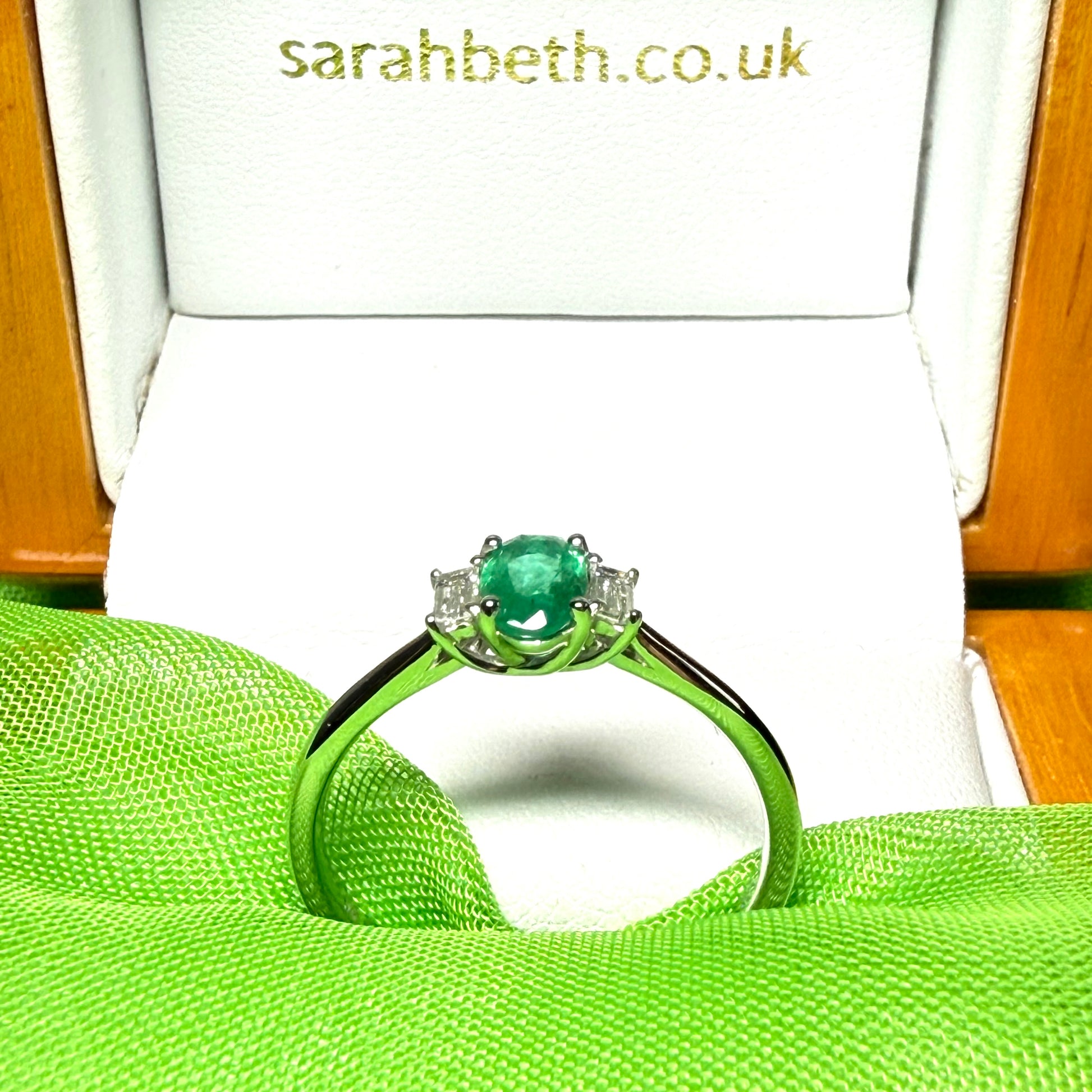 Real emerald and diamond three stone trilogy ring white gold