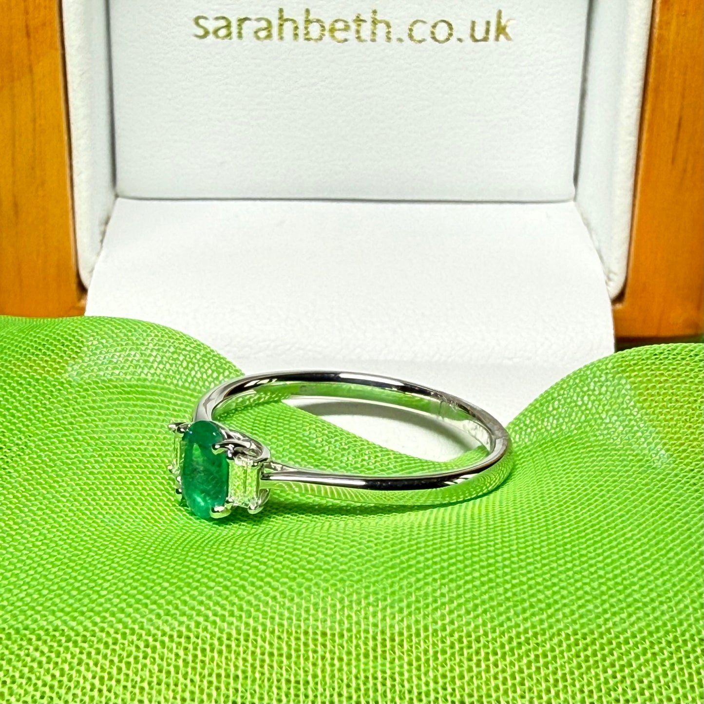 Real emerald and diamond three stone trilogy ring white gold