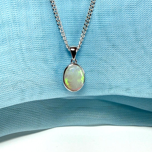 White gold real oval opal pendant rubbed over necklace with chain