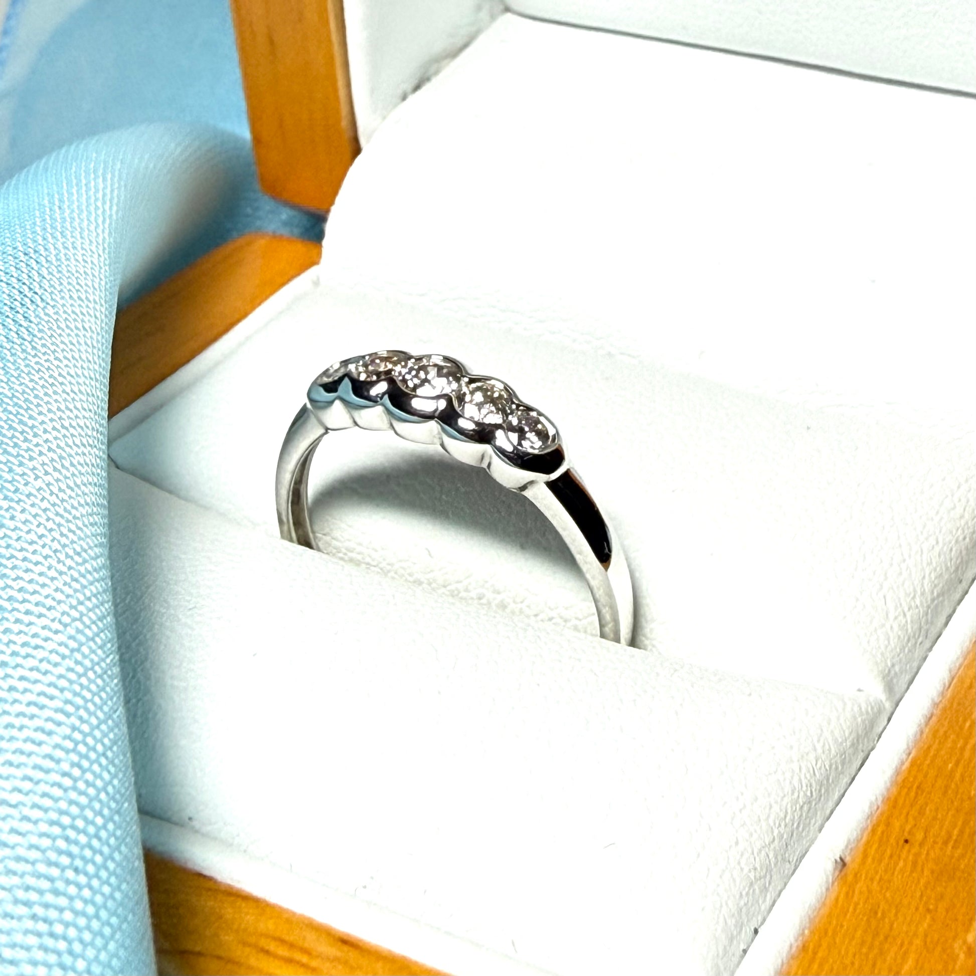 White gold round cut eternity ring diamond rubbed over setting 27 points