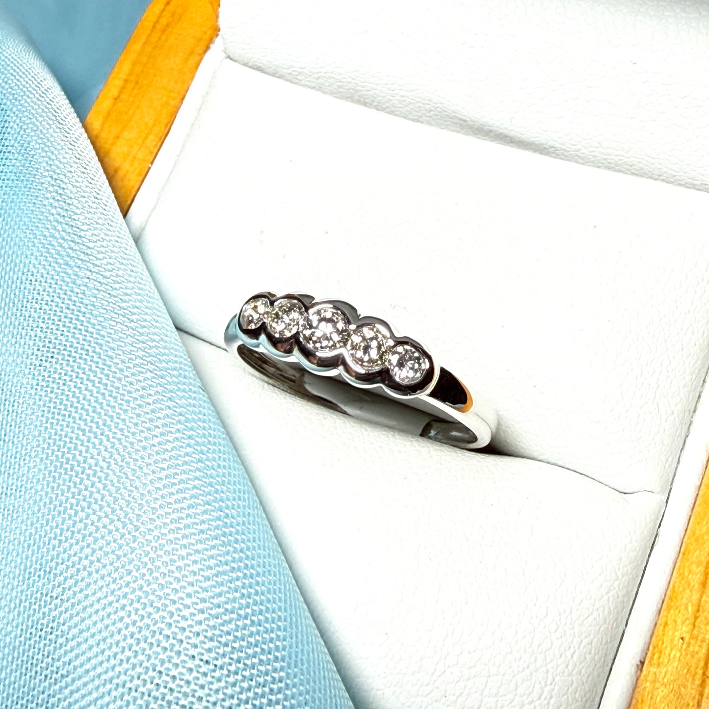 White gold round cut eternity ring diamond rubbed over setting 27 points
