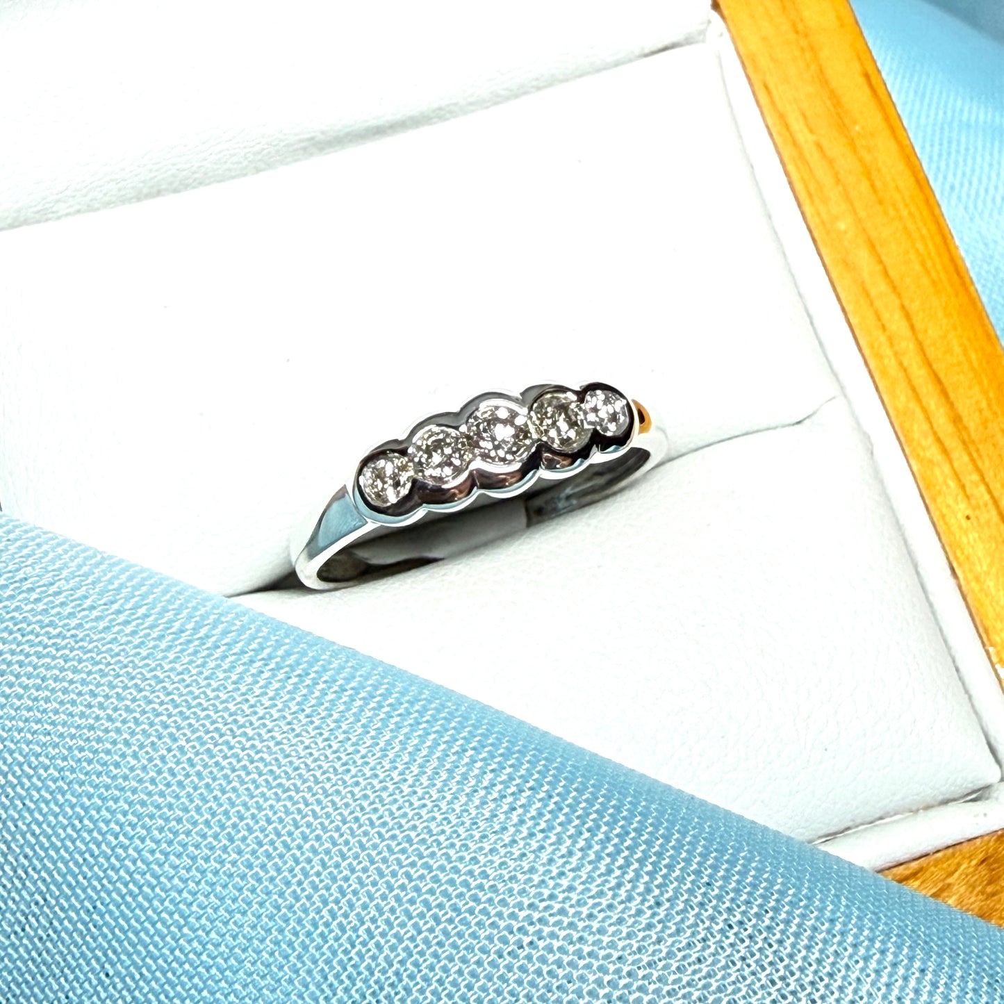 White gold round cut eternity ring diamond rubbed over setting 27 points
